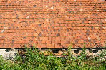 Old rural house with the orange tiled roof