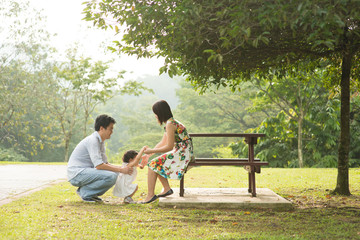 Happy Asian Family enjoying their time in the park