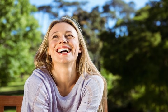 Pretty blonde relaxing in the park
