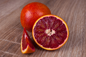 red blood sicilian orange whole, half and wedge
