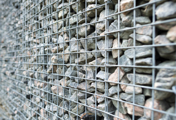 Obraz premium Wall of steel and stones in winter