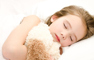 Obraz na płótnie Canvas Adorable little girl sleeping with toy