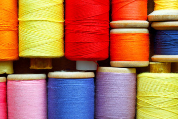 Coils with color threads. Industrial background.