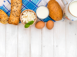 Breakfast of cheese, milk, bread and eggs