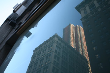 Fototapeta na wymiar reflections of New York skyscrapers in Manhattan, USA
