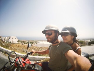 Young couple while taking a Selfie on quad.