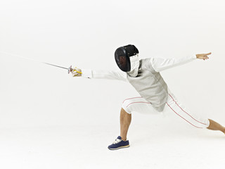 male asian fencer in action
