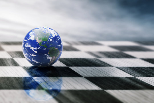 world on chessboard isolated blue sky background
