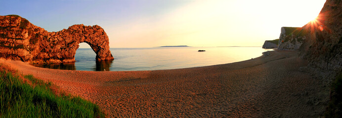 sunset scenery at durdle door beach, dorset