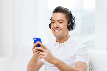 happy man with smartphone and headphones