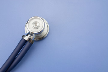 Fototapeta na wymiar Stethoscope on a blue background