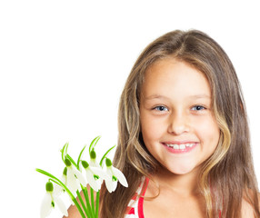 portrait of cute little girl with a bouquet of snowdrops