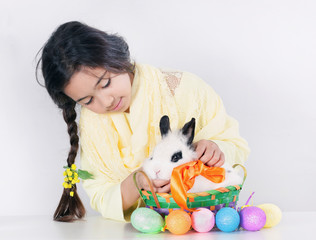 Little girl and soft white bunny