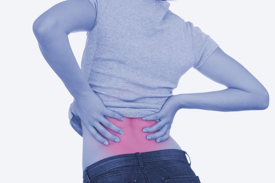 Rear view of woman with backache