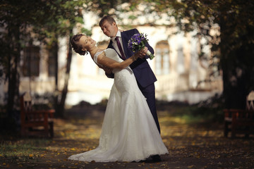wedding photo, bride and groom embracing at wedding