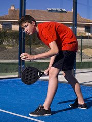 Teen playing paddle
