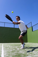 Middle-age man, playing paddle