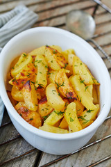 Oven-baked potatoes with garlic and herbs