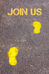 Yellow footsteps on sidewalk towards Join Us message