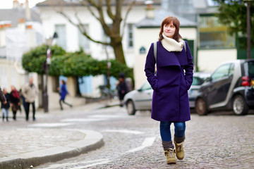 Beautiful young woman sightseeing in Paris