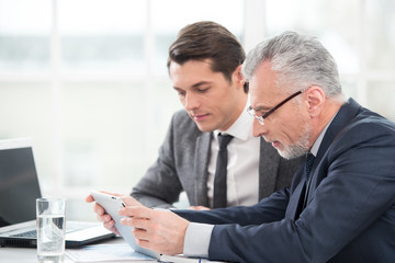 Two businessmen working with documents