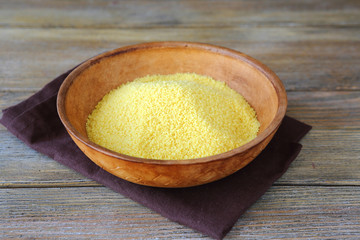 Raw arabic couscous in a clay bowl