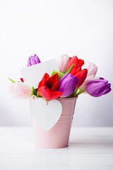 Bunch of tulips and white card