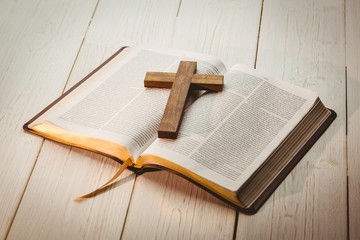 Open bible and wooden cross - obrazy, fototapety, plakaty