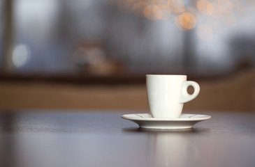 A cup of coffee and beans.