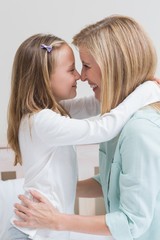 Happy mother and daughter hugging