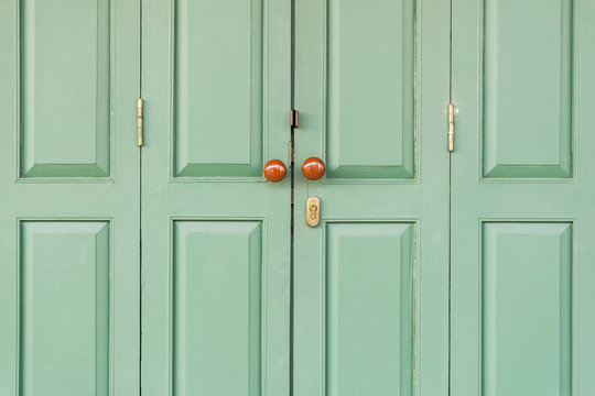 Wooden door with brown knobs