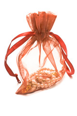 Red gift sack with pearls isolated on white