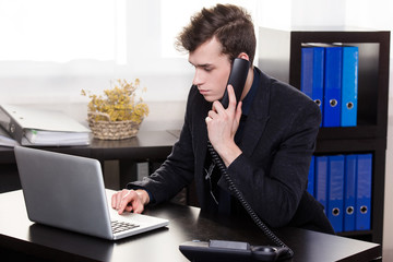 business man call someone