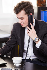 business man call someone