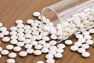 Dropped glass with pills