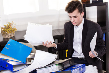 Business man have so many paperwork in the office