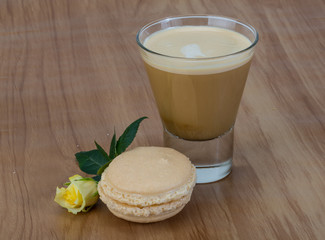 Coffee with macaroons and rose