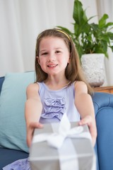 Little girl holding a gift