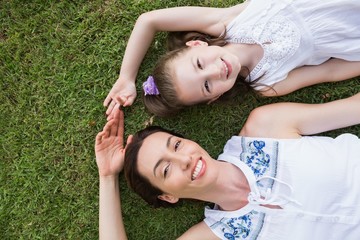 Mother and daughter smiling at camera