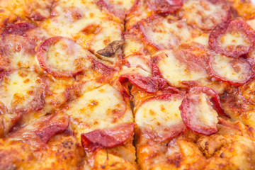 Close up view of pepperoni and cheese pizza