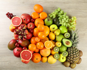 Assortment of exotic fruits on wooden background