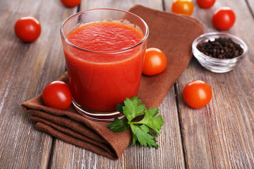 Glass of tomato juice with cherry tomatoes