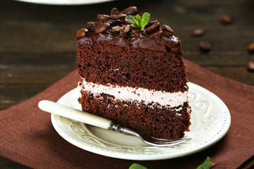 Delicious chocolate cake on table close-up