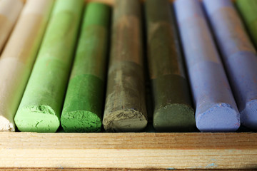 Colorful chalk pastels in box close up