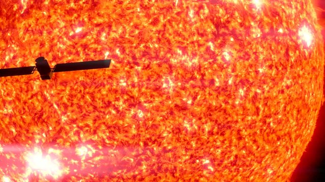 Satellite passes the sun in silhouette