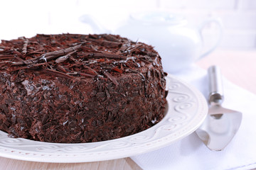 Tasty chocolate cake on table close up