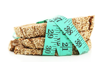 Fresh bread with measuring tape, isolated