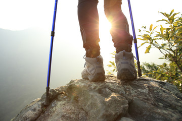 hiking legs sunrise mountain peak