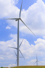 Fototapeta premium Wind Turbine for alternative energy on background blue sky .