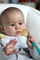 Baby with spoon